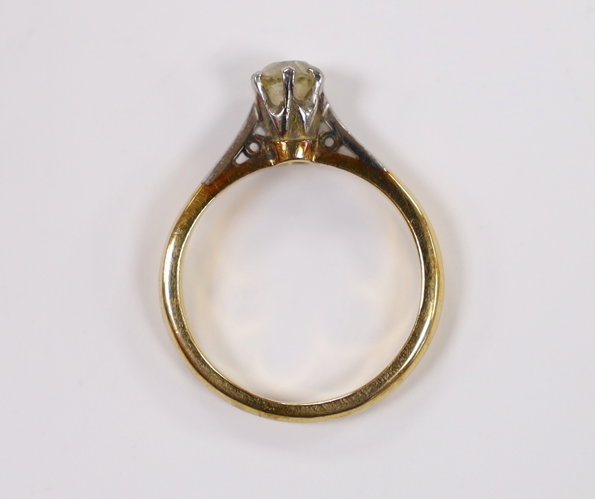 A yellow metal and solitaire diamond set ring, size G/H, gross weight 2.7 grams.